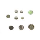 Nine Roman coins.