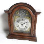 A Lincoln 31 Day 'Tempus Fugit' wood cased mantel clock. With an arched top.