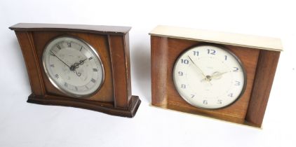 Two mid-century English eight day floating balance mantel clocks.