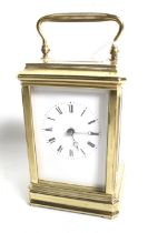 A French striking carriage clock in a corniche brass case.