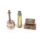 A Korean War 'Trench Art' table lighter and cigarette holder and another shell case.