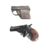 Two blank firing pistols. Comprising one Derringer and one DRGM, one 3-4mm and one 5mm calibre.