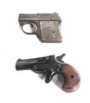 Two blank firing pistols. Comprising one Derringer and one DRGM, one 3-4mm and one 5mm calibre.