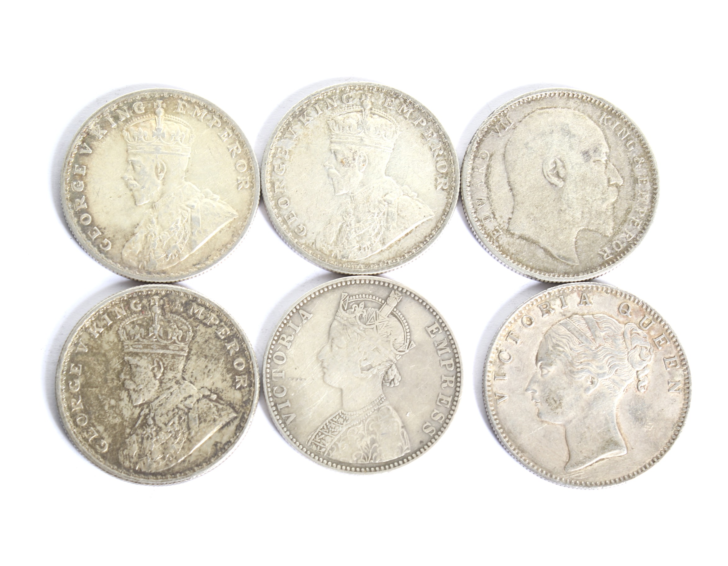 A group of six Indian Rupees coins. Dated 1840; 1907; 1917; 1918; 1919 and Bikanir Victoria Rupee.