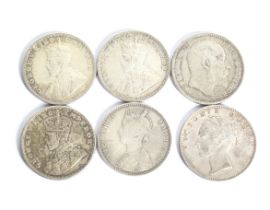 A group of six Indian Rupees coins. Dated 1840; 1907; 1917; 1918; 1919 and Bikanir Victoria Rupee.
