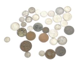 A collection of thirty-four Indian 19th and 20th century coins.