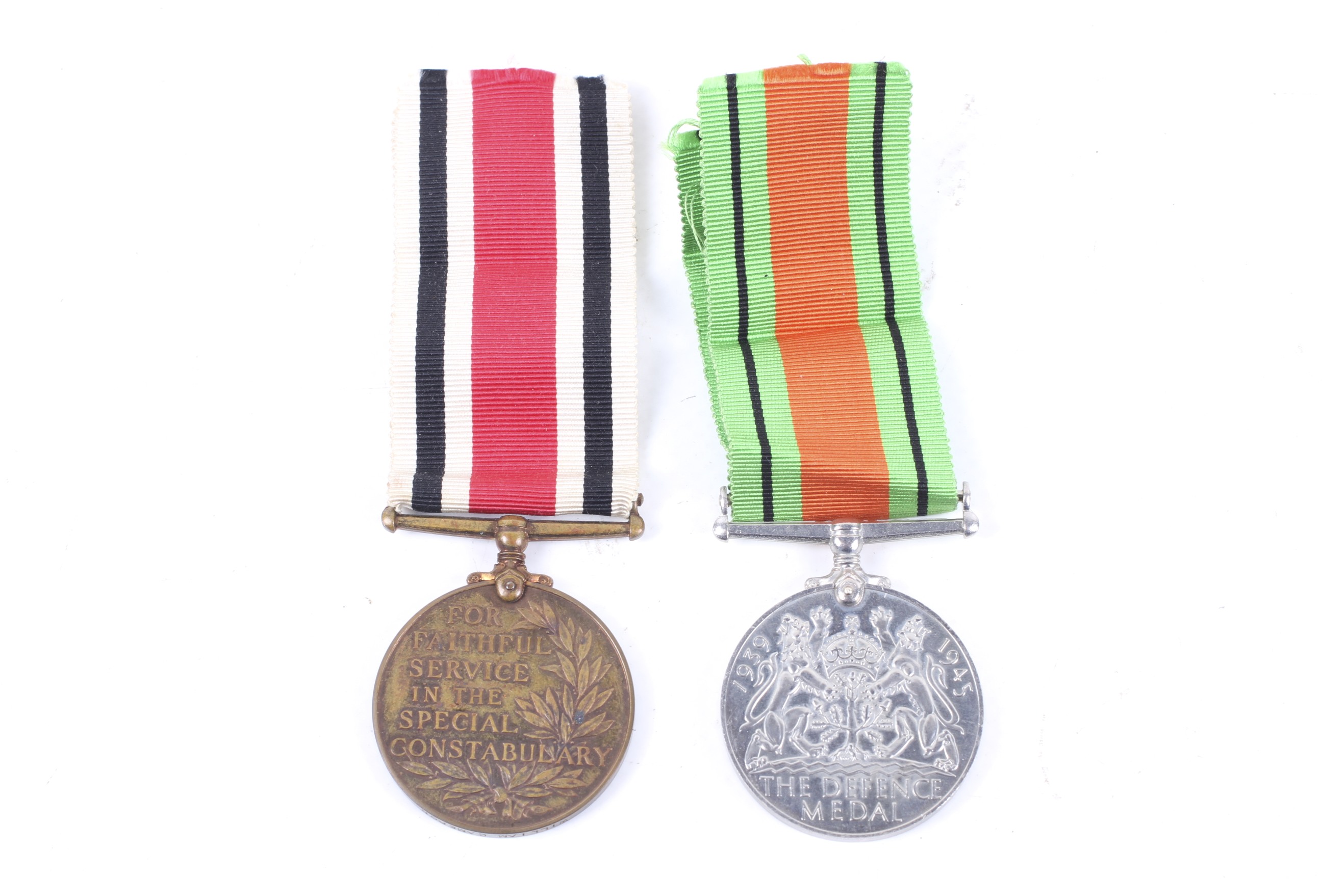 The WWII Special Constabulary medal (William Cameron) and Defence Medal (unmarked). Both on ribbons.