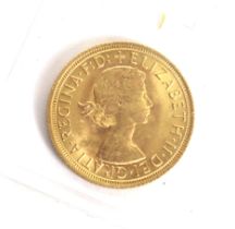 A 1966 sovereign coin.