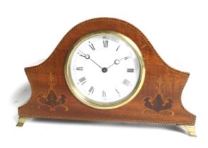 An early 20th century solid mahogany cased inlaid Swiss mantel clock.