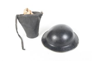 A WWII Brodie helmet and a gas mask.