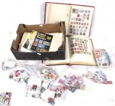 A worldwide collection of stamps in two albums plus loose.