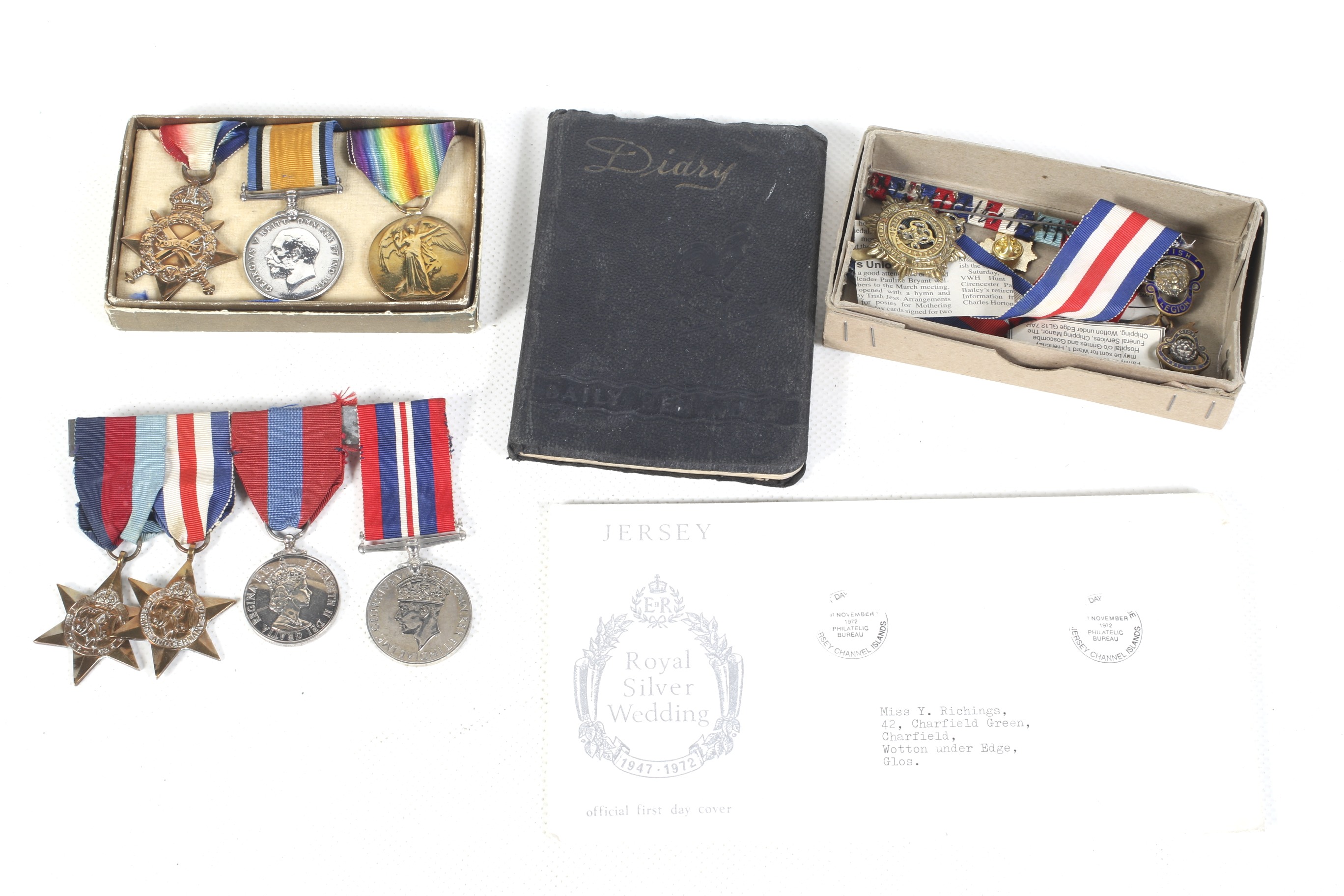 A collection of WWI and WWII medals and ephemera.