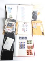 A cardboard box of stamps and first day covers.