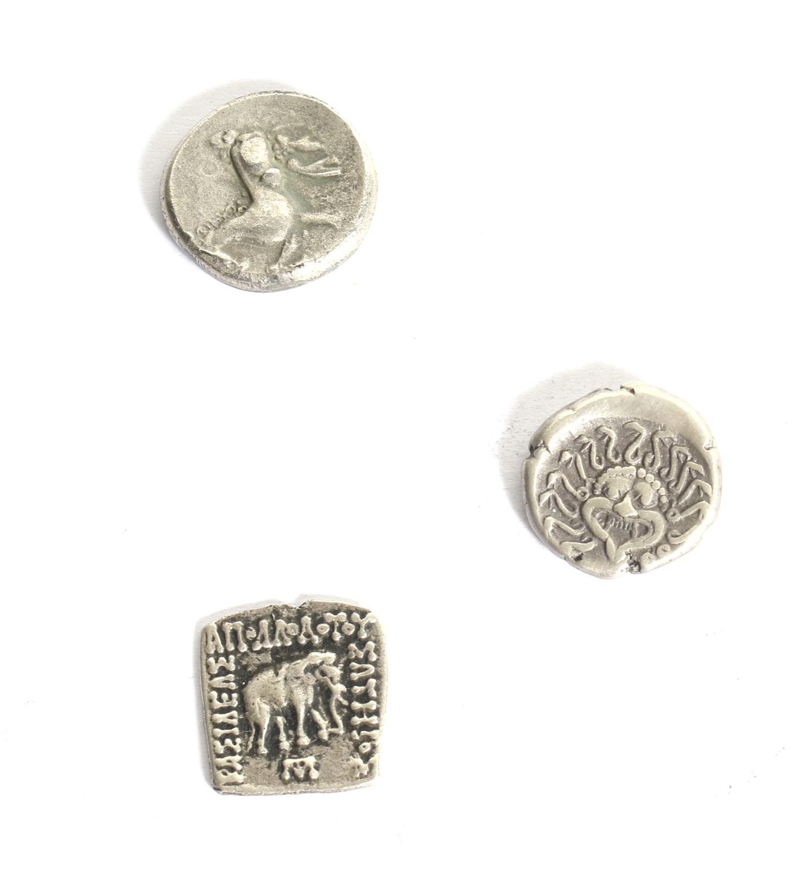 A group ot three Ancient Greek coins.
