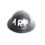 A WWII Home Front ARP helmet, dated 1939.