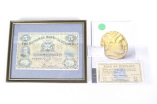 Two Scottish bank notes. The National Bank of Scotland blue Five Pounds note, 1940, faded - framed.