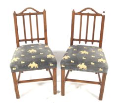Pair of 19th century Gothic Revival style pitch pine stick back chairs.