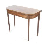A Victorian 'D-shape' mahogany card table.