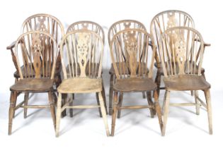 Eight 20th century Windsor wheelback chairs.