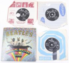 A collection of Beatles records.