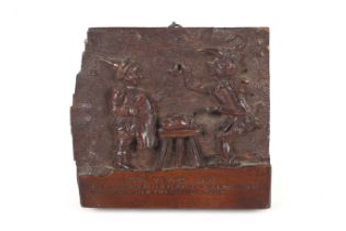 A 19th/20th century carved panel. 'Long Years Ago' depicting a jester and a butcher,