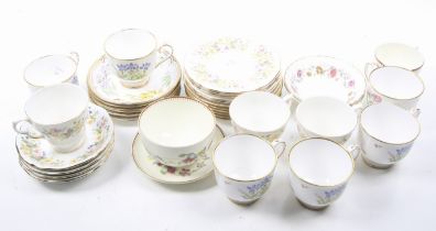 A collection of assorted 20th century floral tea cups and saucers.