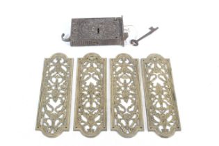 A cast metal door lock with key and a set of four door plates.