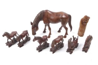 Seven boxwood horse figures and a boxwood netsuke.