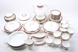 An Aynsley dinner service in white with red and gilt borders.