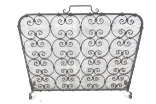A 20th century wrought metal work fire screen.