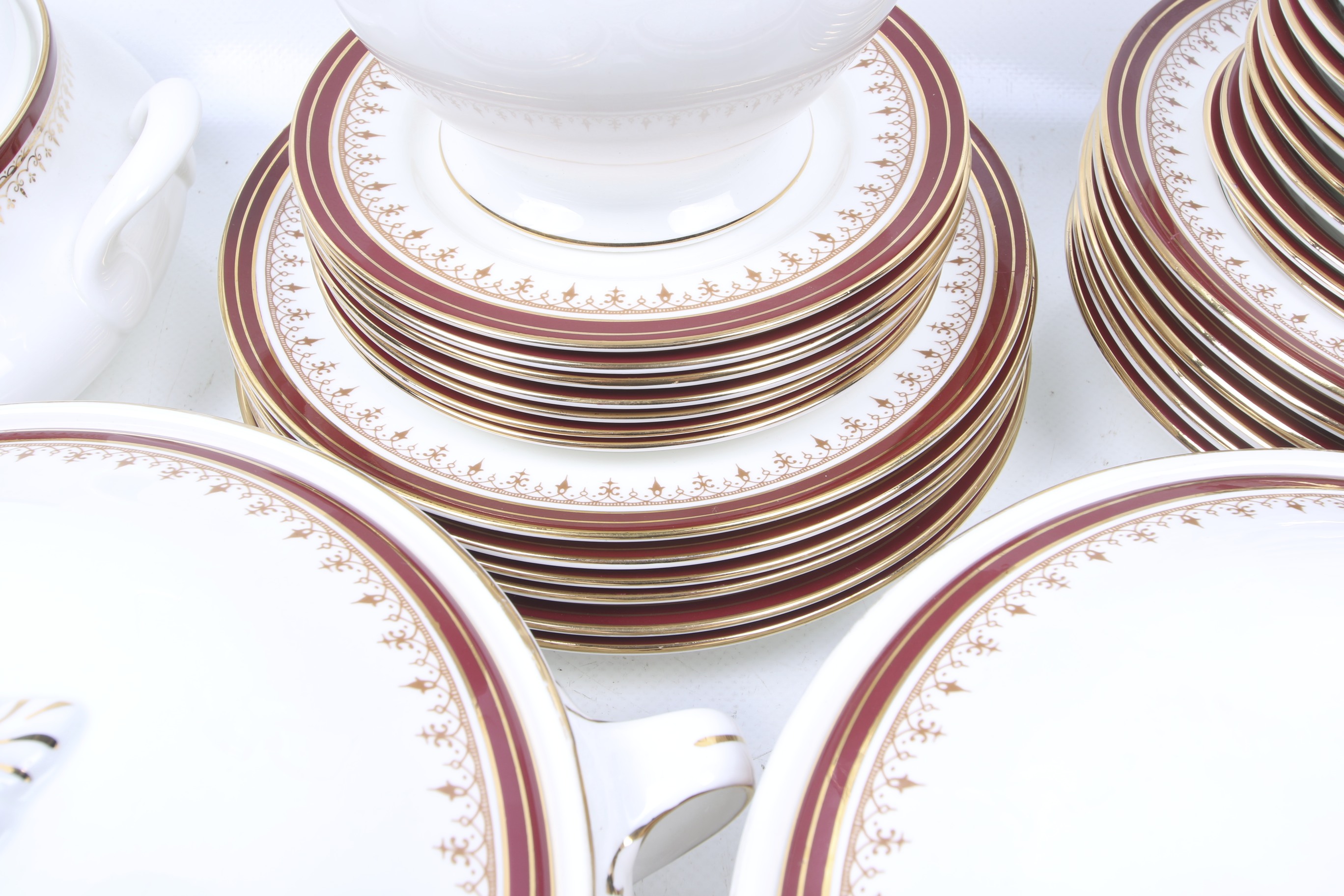 An Aynsley dinner service in white with red and gilt borders. - Image 2 of 3