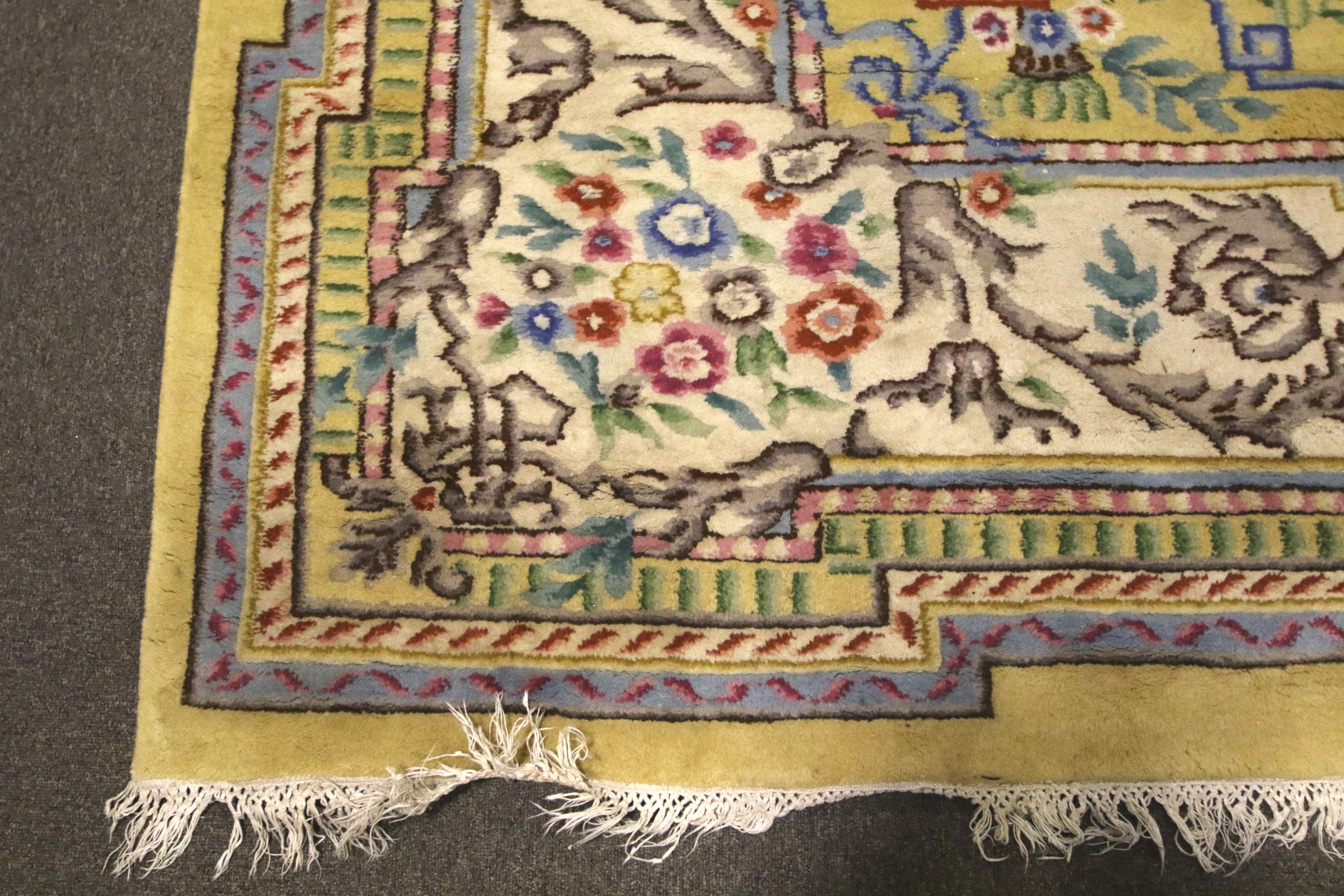 A large Chinese style yellow ground wool rug. - Image 2 of 3