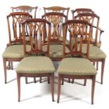 Eight upholstered dining chairs.