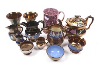 A collection of 20th century lustreware. Including a teapot, jugs, a tankard, goblet, etc.