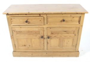 A 20th century pine sideboard cupboard.