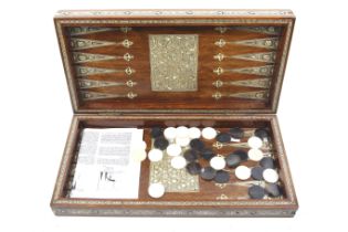 An Egyptian backgammon set and games box.