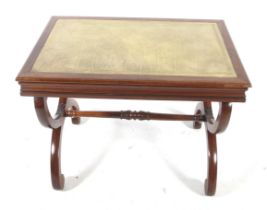 A Regency style mahogany X-frame writing table desk.