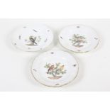 Three Meissen porcelain plates.