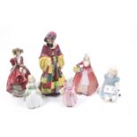 A collection of six Royal Doulton porcelain lady and girl figurines.