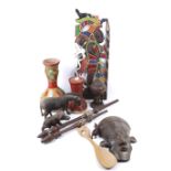 A collection of mostly African tribal artifacts.