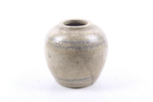 A possibly Ming dynasty beige glazed stoneware jar.