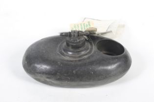 A Victorian pewter posset warmer. Of oval shape with a single handle to the top marked '1875'.