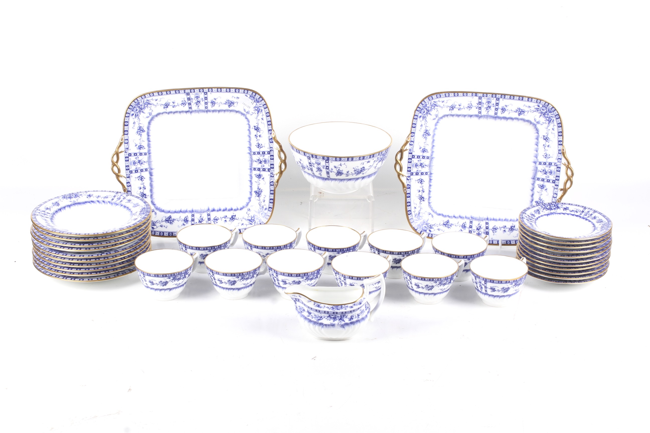 A Wedgwood tea service. With blue and white borders of flowers within gilt rims.