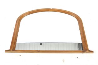 A contemporary pine framed overmantel wall mirror. Of dome form.