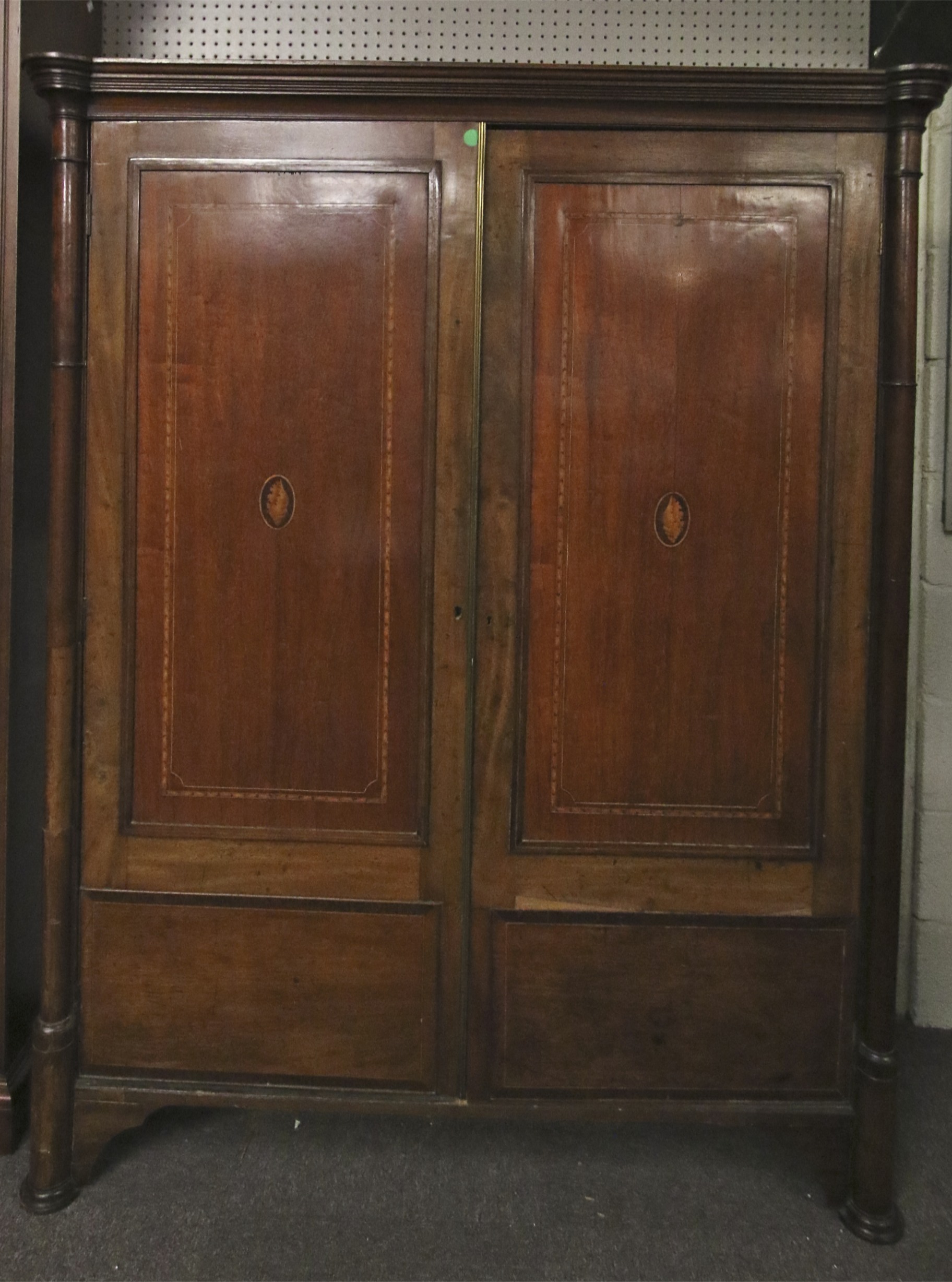 A Sheraton revival mahogany and inlaid wardrobe.