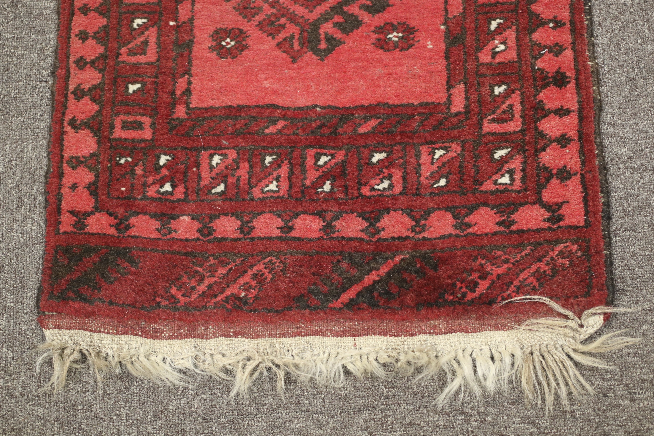 A Persian hand woven woollen runner. - Image 2 of 3