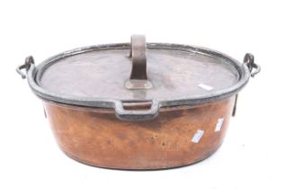 A 18th/19th century copper and wrought iron hanging oval lidded cooking pot.