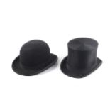 A vintage top hat and a bowler hat.