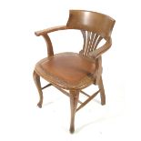 A 20th century oak elbow chair.