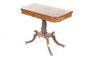 A Regency mahogany fold over inlaid tea table.